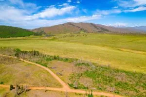 2.5 Acre Pre-Cleared Hillside Lot With Underground Utilities In Upscale Forested Community