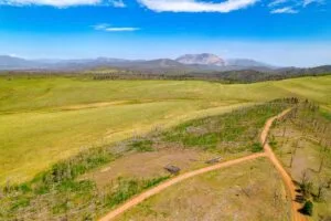 2.5 Acre Pre-Cleared Hillside Lot With Underground Utilities In Upscale Forested Community
