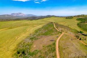 2.5 Acre Pre-Cleared Hillside Lot With Underground Utilities In Upscale Forested Community